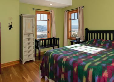 a bedroom with a bed and a dresser