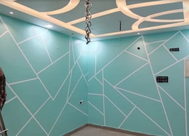 Interior painting project featuring living room with accent wall in modern color scheme
