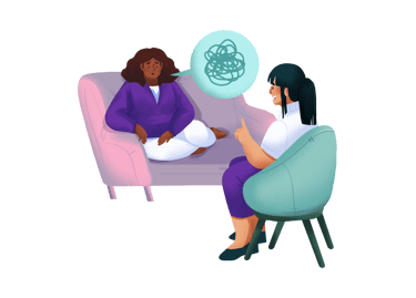 a woman sitting on a couch with a woman in a chair