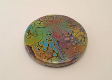 Handmade acrylic pour art coaster featuring vibrant rainbow colors and a unique cell pattern design.