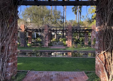 Vine-covered brick trellis and pond at the Santa Barbara El Encanto Hotel.