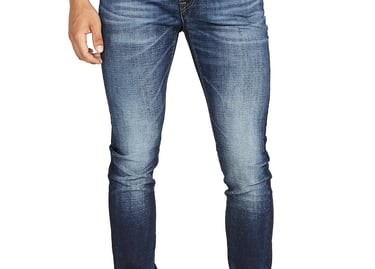 a man in a gray shirt and jeans