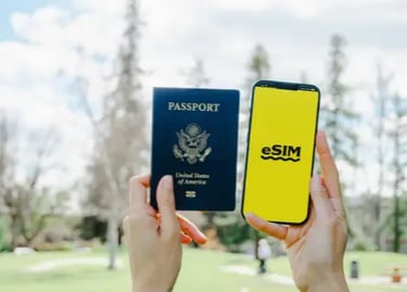 Hands holding a US passport and a smartphone displaying an eSIM logo for international travel connectivity.