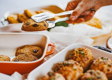 Taking cookies from the oven plate on the table