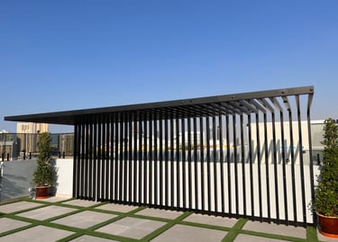 Custom-built rooftop sunshade structure and pergola for outdoor terrace lounge.