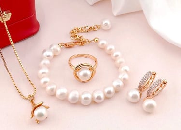 a jewelry set with pearls and a necklace