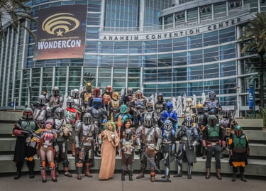 Star Wars Mandalorian cosplayers posing at WonderCon outside the Anaheim Convention Center.