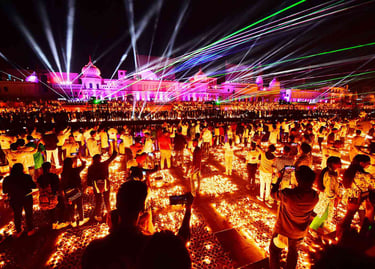 Crowds celebrate Diwali with a vibrant laser light show and thousands of oil lamps at an Indian temple.