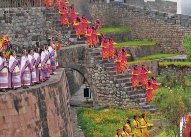 Performers in traditional Andean dress descend stone stairs during an Inti Raymi festival at Qorikancha, Peru.