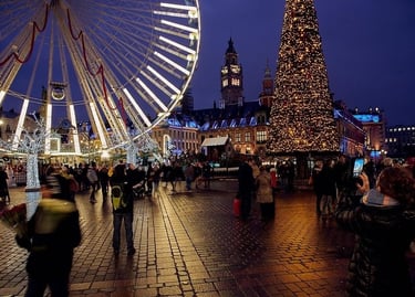Crowds visit a festive Christmas market at night with a lit Ferris wheel and glowing holiday tree.
