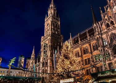 Marienplatz in Munich, Germany, showcases a magnificent Christmas tree adorned with festive lights and charming market
