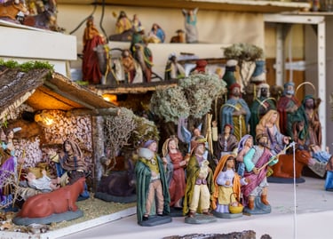 Detailed traditional Christmas nativity scene figurines including Baby Jesus in a stable and the Three Wise Men.