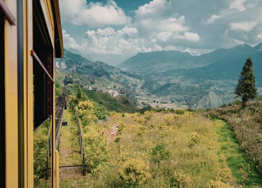 Muong Hoa Valley view from the Sapa mountain train window in Vietnam with lush green hills.