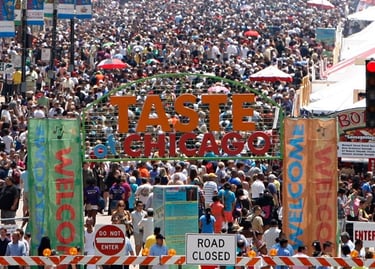 A massive crowd gathers at the Taste of Chicago food festival entrance in Grant Park.
