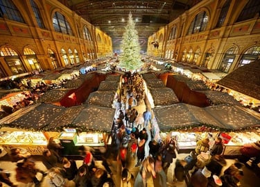 Crowded indoor Zurich Christmas market at the main train station featuring a tall illuminated tree and stalls.