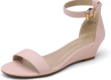 a woman's pink wedged sandal with a gold buckle