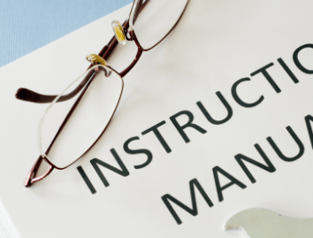 glasses on a instruction manual