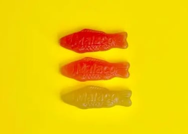 Fish candies, representing neurodivergence. Professional hypnotherapy in Geneva, ASCA-certified.