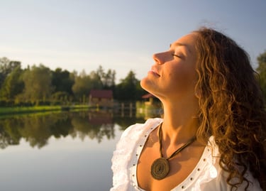 a woman with long hair and a necklace hypnosis, meditation for weight loss
