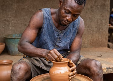 An intimate gallery space featuring sculptures inspired by African heritage.