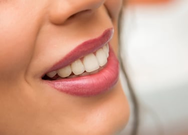 A woman with a toothbrush and a toothbrush in her mouth
