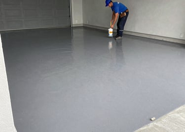 Decorative flake epoxy garage floor coating installation in residential garage