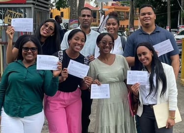 a group of people standing around a group of people holding up papers