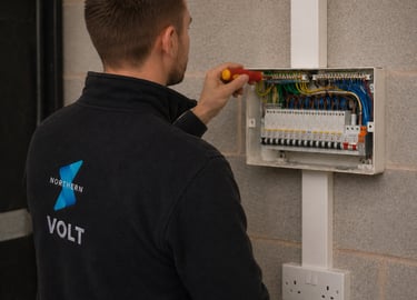 Electrician working on consumer unit