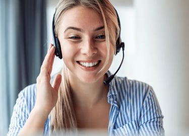 Friendly real estate photography customer support agent assisting a client via headset