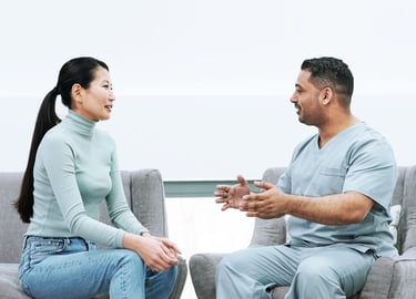 male doctor of color consulting with female patient of color