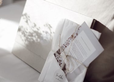 a small bouquet of flowers and a card with a notepad