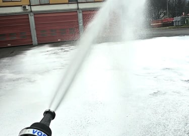 a fire hydrant spraying cafs foam out of a fire hydrant
