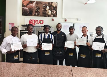 culinary training courses in UAE with chefs receiving certificates in professional kitchen