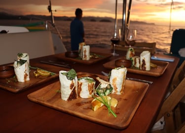 Gourmet appetizers served at sunset onboard private catamaran in Papagayo Gulf