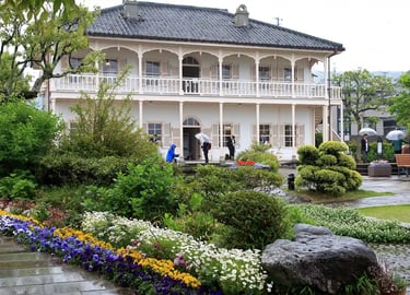 Former Mitsubishi No. 2 Dock House in Nagasaki, a historic Western-style building overlooking the ha