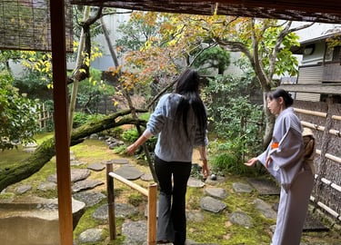 Woman receiving an introduction in a traditional tea garden during a Japanese tea ceremony experienc