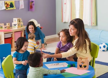 Teachers and toddlers engaging in creative activities in a colorful daycare classroom