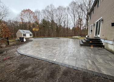 outdoor patio surrounding pool area