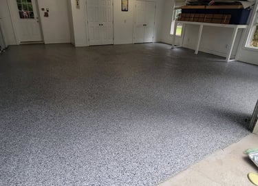 a garage flooring with a garage flooring and a garage door