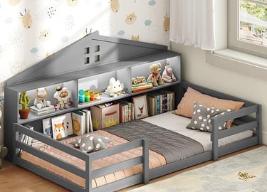 Gray wooden house-shaped floor bed for kids featuring built-in bookshelves and storage headboard.