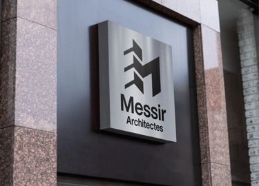architectes modern logo sign mounted on a sleek office building exterior.