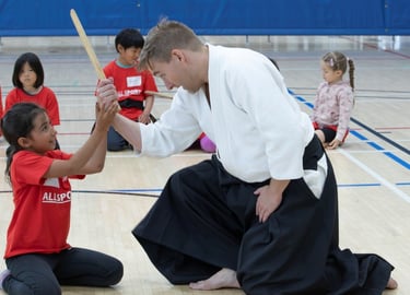 student and instructor practicing kotegaeshi in Calgary aikido class