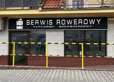 a service bike and snowboard skis center with a sign that says service overcrowing