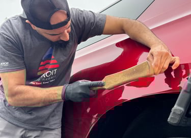 Mr. Sam knocking down a Tahoe to fix a ding