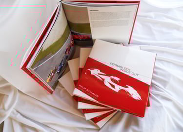 Ferrari FXX Inside Out - Book cover and stack of books