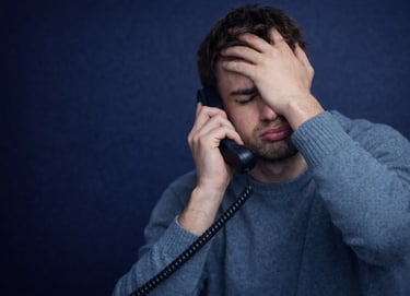 Frustrated customer experiencing a stressful customer service phone call