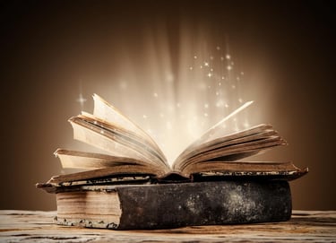 Open book, glowing with stars