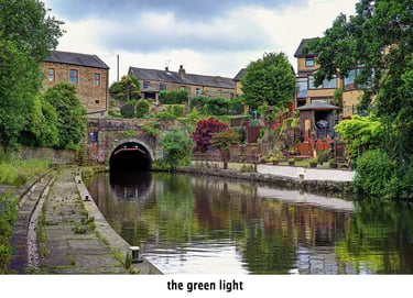the green light at a canal tunnel on the leeds and liverpool canal