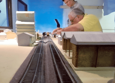 Building model train layout, father and son