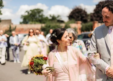 a man and woman walking down a street